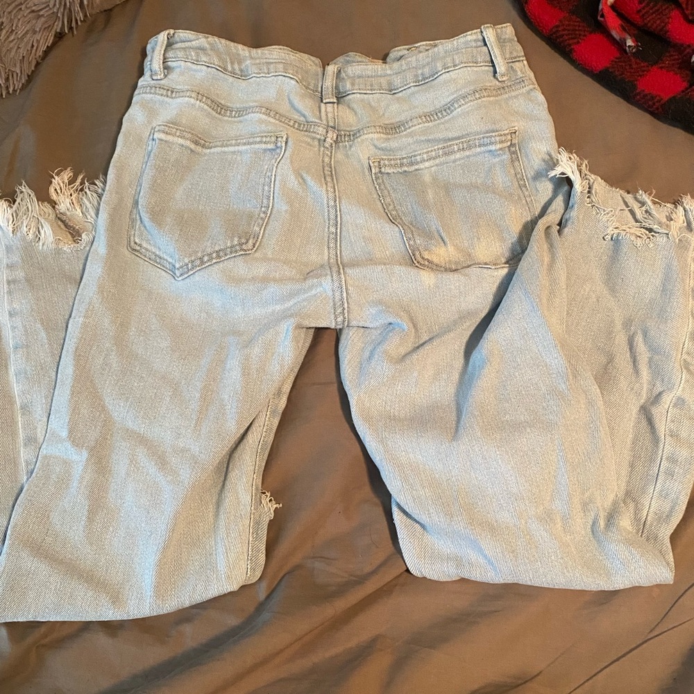 Forever 21 ripped jeans  light washed with little “ bleach spot “